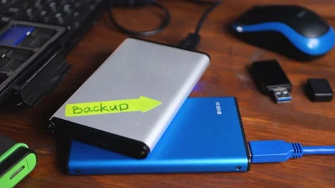 External hard drive on table in home office Stock Footage 164189642