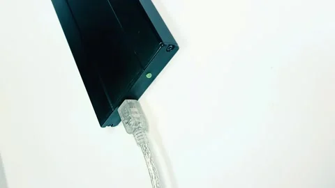 External Hard drive with usb cable. Shot. HDD isolated on white background Stock-Footage 142027545