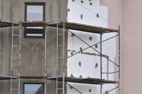 External insulation of the walls of the house with white expanded polystyrene Stock Photos