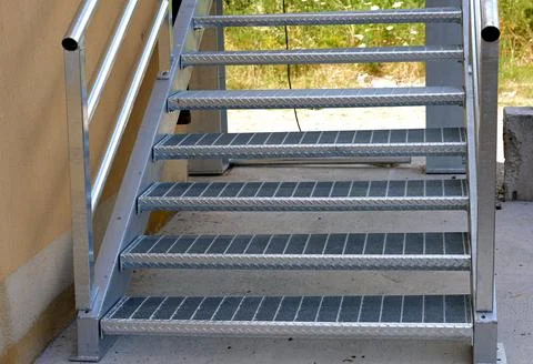An external metal fire escape made of galvanized steel. Stock Photos