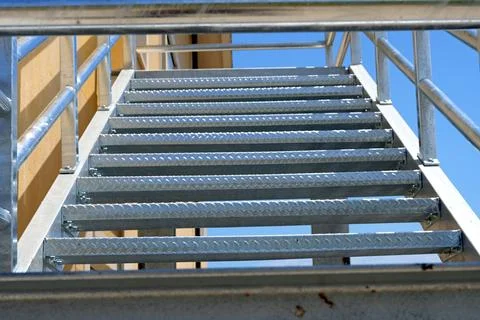 An external metal fire escape made of galvanized steel. Photos