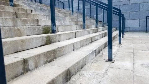 External multi-stage stone staircase. There are a lot of stairs and railings Stock-Fotos