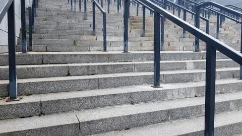 External multi-stage stone staircase. There are a lot of stairs and railings 写真素材