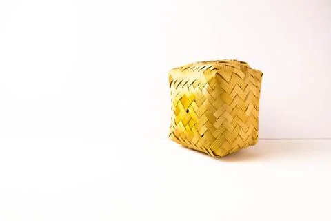 External side view small hand-woven bamboo wicker container with lid Stock Photos