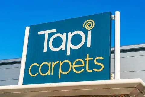 External signage of UK based carpet and flooring supplier, Tapi Carpets Stock Photos