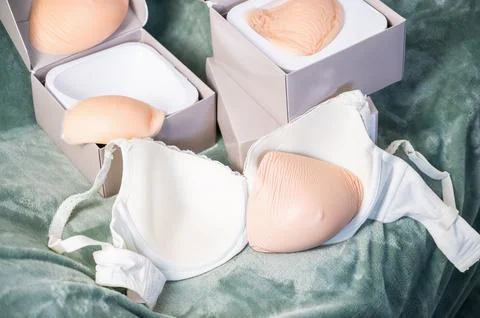 External Silicone breast forms in boxes and post-mastectomy bra for recovery Stock Photos