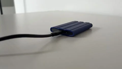 External SSD Connected to Computer for Backup and File Storage Stock Footage 340407541