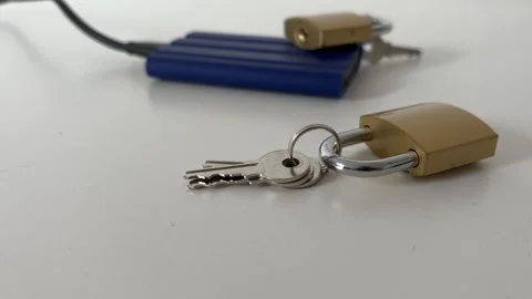 External SSD With Padlocks and Keys for Data Security Concept Stock Footage 340407536