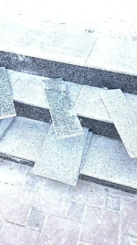 External stair cladding using textured grey granite for durability and safety. Stock Footage 332202734