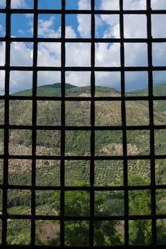 External view of an ancient vintage window of a medieval town in Italy, Europe. Stock Photos