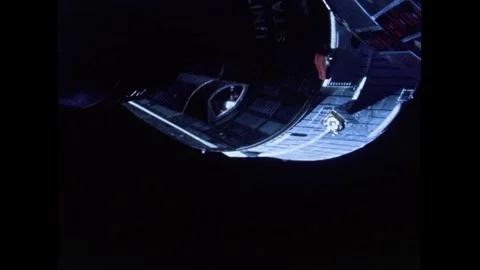 External view of astronaut inside space capsule during orbit Stock Footage 263445474