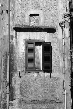 External wall building with window and sacred image Foto stock