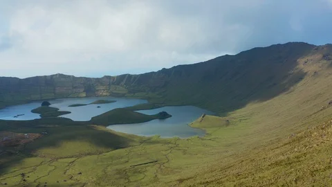 Extinct Caldeirao volcano and two lakes on the floor of huge caldera. Aerial of Video stock 117769446