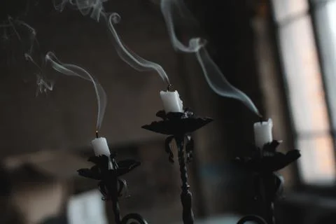 Extinct candle on a candlestick Stock Photos