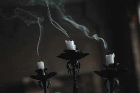 Extinct candle on a candlestick Stock Photos