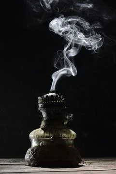 Extinct kerosene lamp on the table Stock Photos