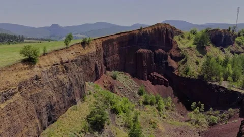 The extinct volcano. Aerial view of volcanic crater covered by green meadow Stock-Footage 314040541