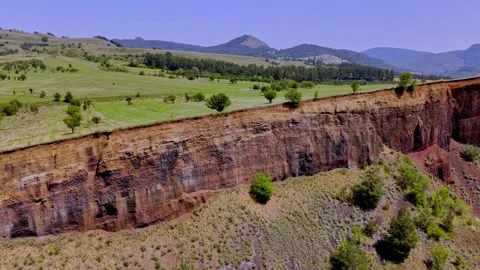 The extinct volcano. Aerial view of volcanic crater covered by green meadow Stock Footage 314043068