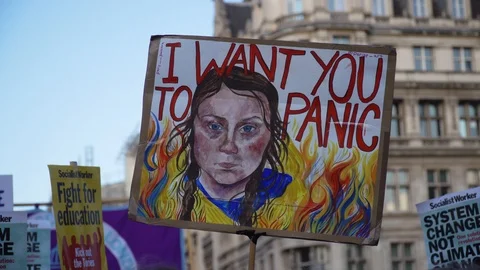 Extinction Rebellion Climate Change Protest, Greta Thunberg Placard Stock Footage