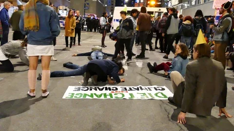 Extinction rebellion people laying down on the street Stock Footage 120058477