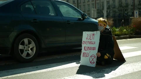 Extinction rebellion protest blocking block the traffic road way cars Video stock 153416330