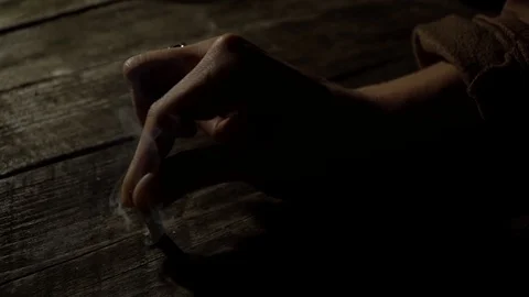 Extinguish the cigarette on the table Stock Footage 91183680