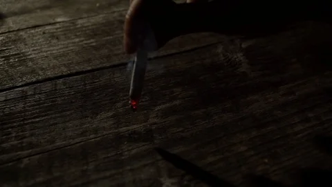 Extinguish the cigarette on the table Stock Footage 91183697