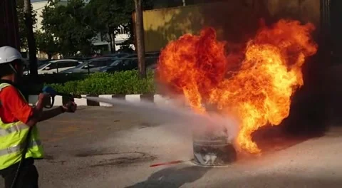 Extinguish the fire using water jet fire fighting system Stock Footage 243161234