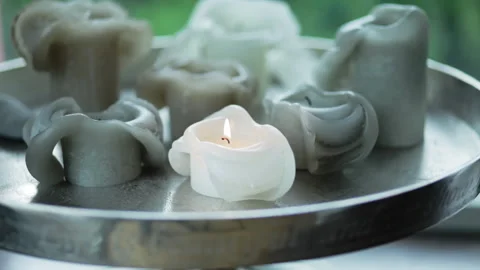 Extinguish a white candle on a table 動画素材 133497401