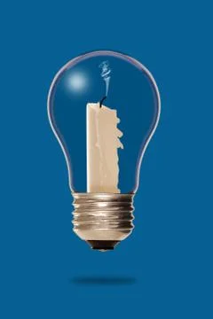 Extinguished candle inside a light bulb Stock Photos