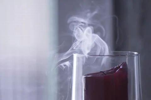 Extinguished candle smoke Stock Photos