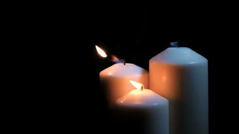 Extinguished candles with smoke on a black background Video stock 133872404