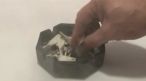 Extinguished a cigarette in an ashtray Stock Footage 978754