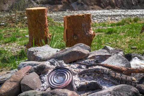 Extinguished fire on the river bank Foto stock