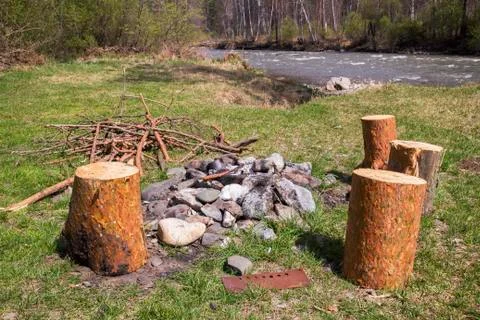 Extinguished fire on the river bank Foto stock