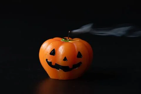 Extinguished Jack-O-Lantern Candle with Smoke Stock Photos