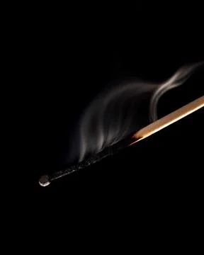 Extinguished match isolated on a black background Stock Photos