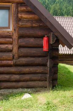 Extinguisher in the corner Stock Photos