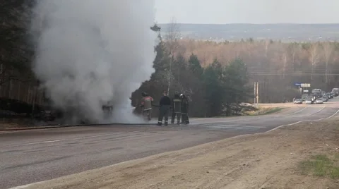 Extinguishing of the burning bus Stockbeeldmateriaal 4848420