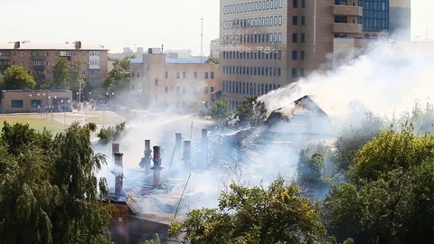 Extinguishing a fire at a distance from afar from a hill - a strong smoke Stock Footage 80255960