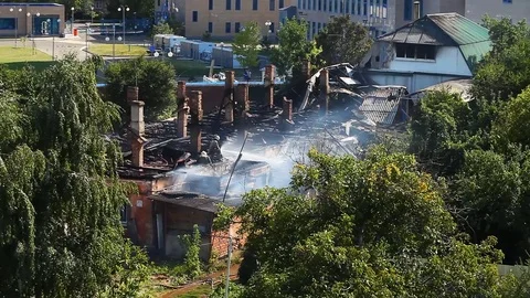 Extinguishing a fire at a distance from the elevation view from afar Stock Footage 80020049