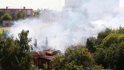 Extinguishing a fire at a distance from the elevation view from afar Stock Footage 80255293