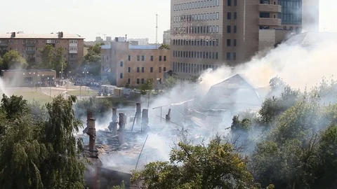 Extinguishing a fire at a distance from the elevation view from afar Stock Footage 80256265