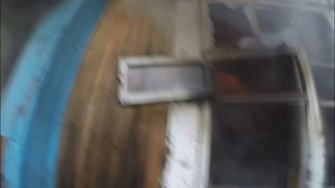 Extinguishing the fire. The fireman dismantles the window and extinguishes. Video stock 80450118