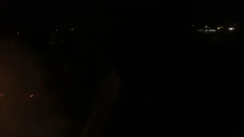 Extinguishing a fire at night. The work of firefighters in difficult conditions. Stock Footage 157910097
