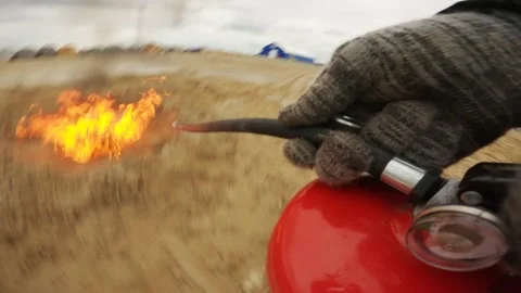 Extinguishing flame with fire extinguisher Stock Footage 202131672