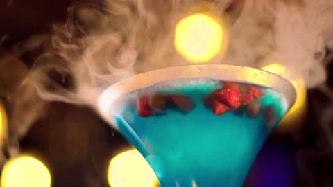 Extra close up blue cocktail with ice smoke slow motion 100fps Stock-Footage 156477084