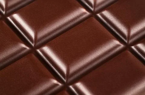 Extra close up of chocolate bar background. Chocolate bar texture. Stock Photos