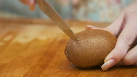 Extra Close up of Slicing kiwifruit with a knife Stock Footage 78490302