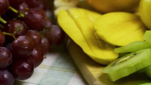 Extra closeup on delicious, wet fruit scattered on counter - tracking shot Vídeo Stock 341206200